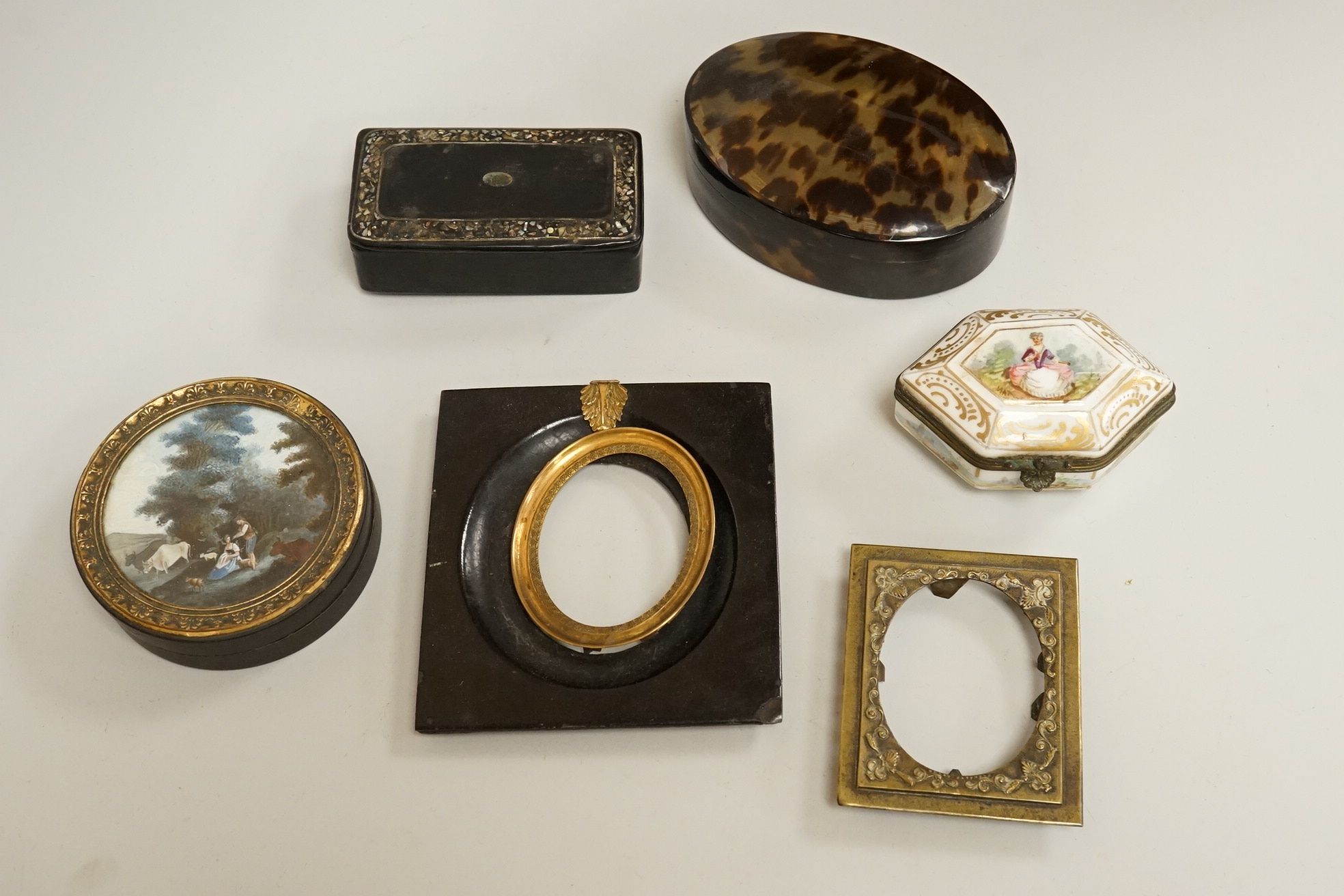 A collection of 19th century and later snuff and pill boxes, a silhouette frame and a gilt metal frame